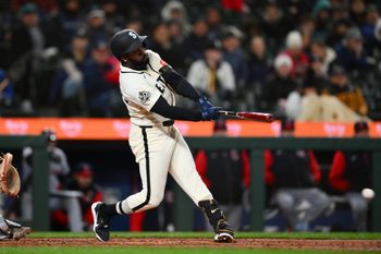 Mar 29, 2026; Seattle, Washington, USA; Seattle Mariners left fielder Randy Arozarena (56) hits an RBI single against the Cleveland Guardians during the eighth inning at T-Mobile Park. Mandatory Credit: Steven Bisig-Imagn Images