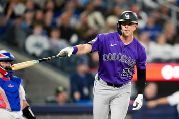 Mar 30, 2026; Toronto, Ontario, CAN;  Colorado Rockies Troy Johnston (20) hits a home rum against the Toronto Blue Jays during the sixth inning at Rogers Centre. Mandatory Credit: Kevin Sousa-Imagn Images
