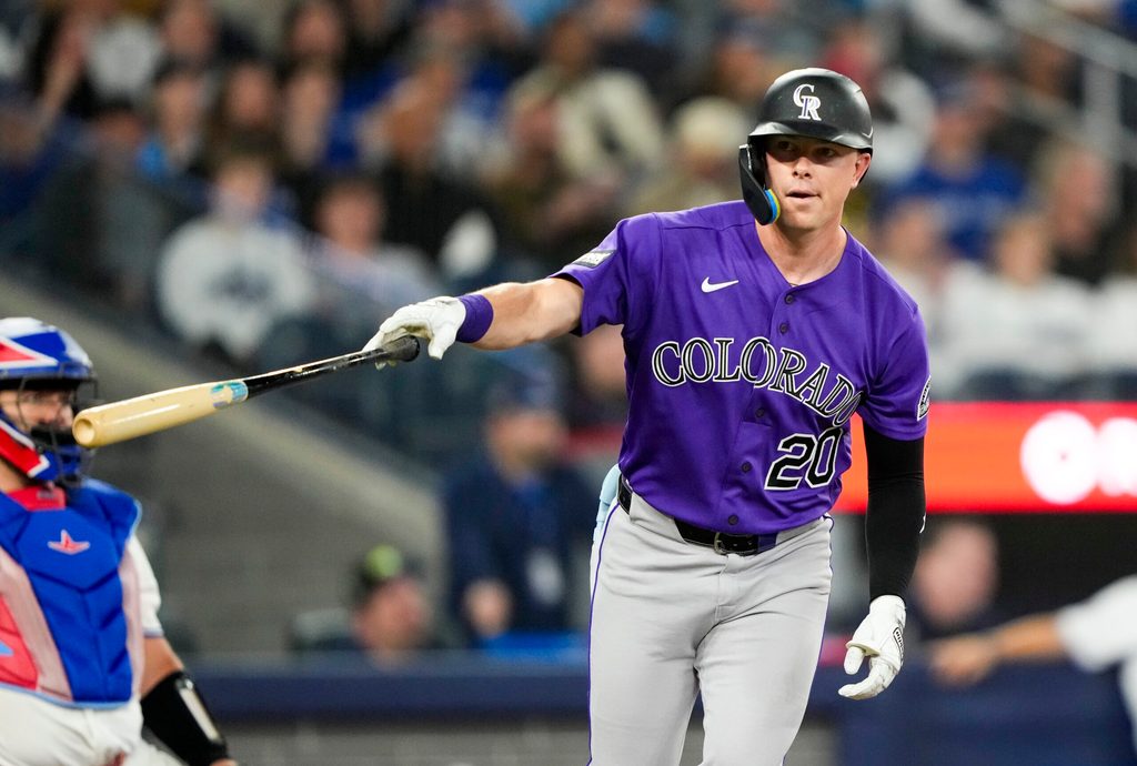 Mar 30, 2026; Toronto, Ontario, CAN; Colorado Rockies Troy Johnston (20) hits a home rum against the Toronto Blue Jays during the sixth inning at Rogers Centre. Mandatory Credit: Kevin Sousa-Imagn Images