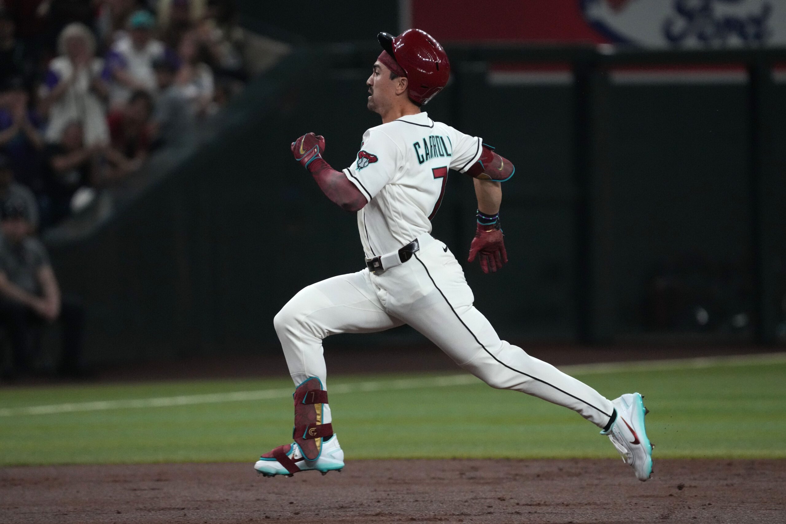 Mar 30, 2026; Phoenix, Arizona, USA; Arizona Diamondbacks right fielder Corbin Carroll (7) hits a triple against the Detroit Tigers in the first inning at Chase Field. Mandatory Credit: Rick Scuteri-Imagn Images
