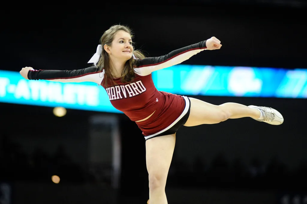 Mar 20, 2014; Spokane, WA, USA; Harvard Crimson cheerleader performs in the first half of a men's college basketball game during the second round of the 2014 NCAA Tournament against the Cincinnati Bearcats at Veterans Memorial Arena. Mandatory Credit: James Snook-Imagn Images