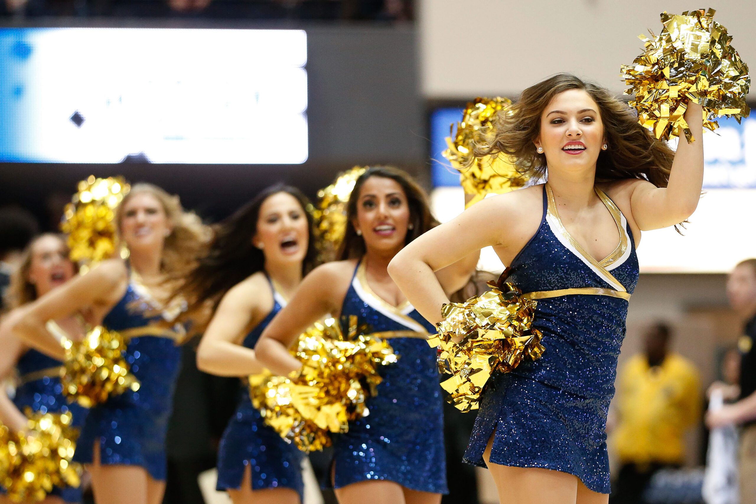 Feb 14, 2015; Washington, DC, USA; George Washington Colonials cheerleaders perform on the court during a stoppage in play against the Virginia Commonwealth Rams at Charles E. Smith Center. Mandatory Credit: Amber Searls-Imagn Images