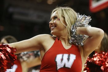 Jan 26, 2016; Madison, WI, USA; A Wisconsin Badgers cheerleader entertains the fans during a timeout in the game with the Indiana Hoosiers at the Kohl Center. Wisconsin defeated Indiana 82-79 (OT). Mandatory Credit: Mary Langenfeld-Imagn Images