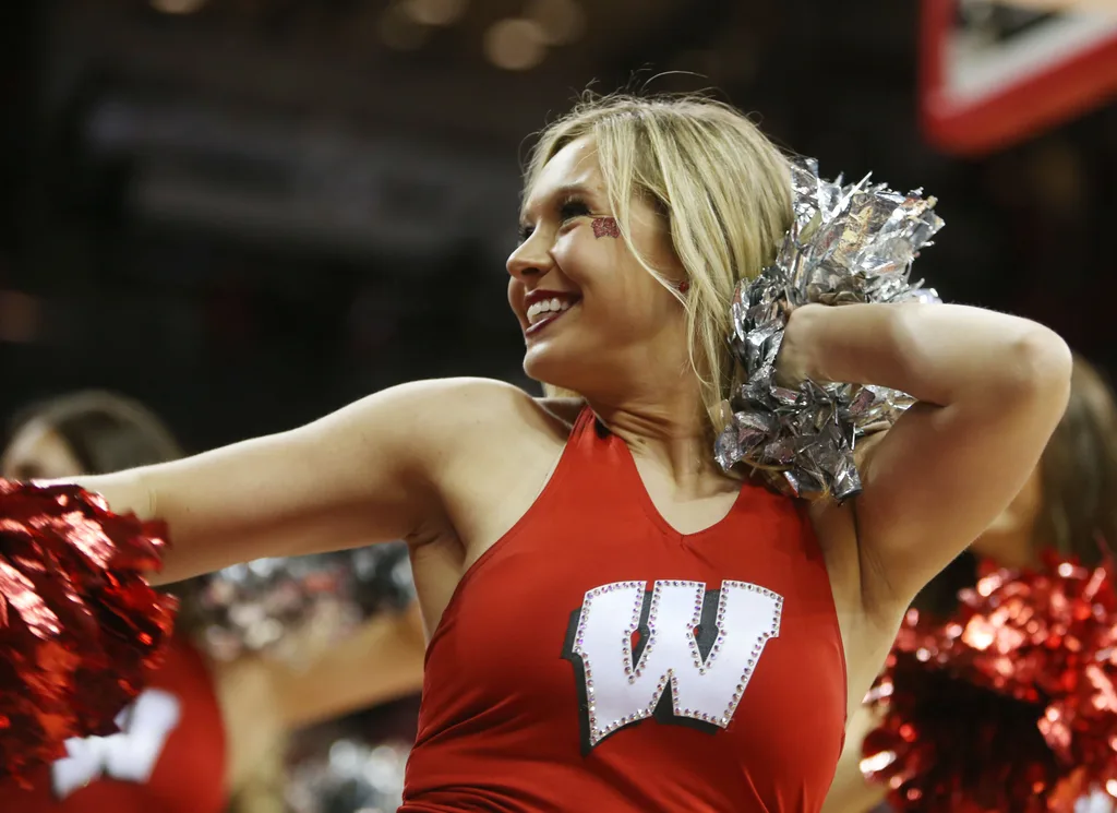 Jan 26, 2016; Madison, WI, USA; A Wisconsin Badgers cheerleader entertains the fans during a timeout in the game with the Indiana Hoosiers at the Kohl Center. Wisconsin defeated Indiana 82-79 (OT). Mandatory Credit: Mary Langenfeld-Imagn Images
