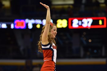 Mar 18, 2016; St. Louis, MO, USA; Dayton Flyers cheerleader waves during the first half of the first round against the Syracuse Orange in the 2016 NCAA Tournament at Scottrade Center. Mandatory Credit: Jasen Vinlove-Imagn Images