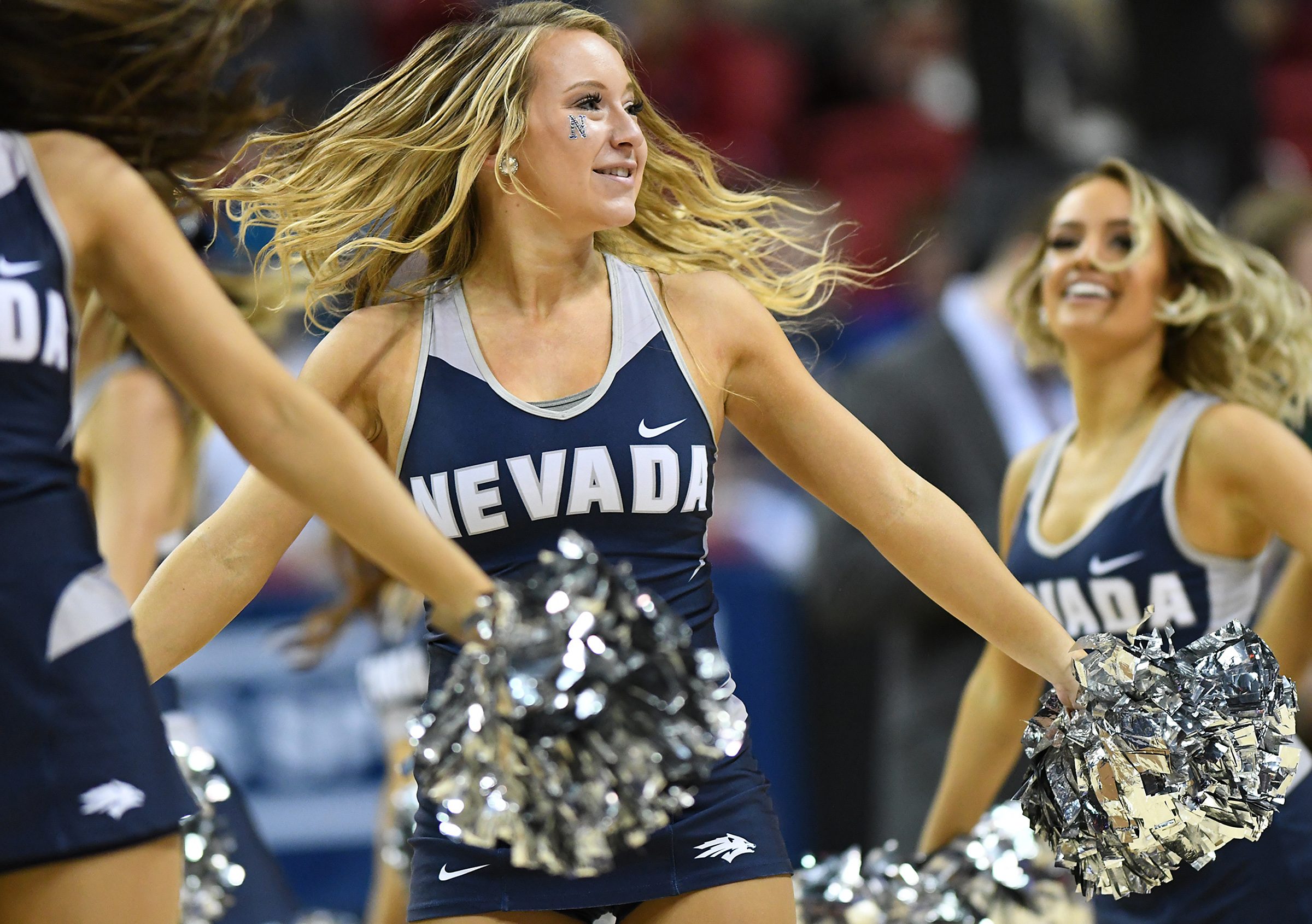 Mar 11, 2017; Las Vegas, NV, USA; Nevada Wolf Pack cheerleaders entertain the crowd during the Mountain West Conference Championship game between Nevada and the Colorado State Rams at Thomas and Mack Center. Mandatory Credit: Stephen R. Sylvanie-Imagn Images