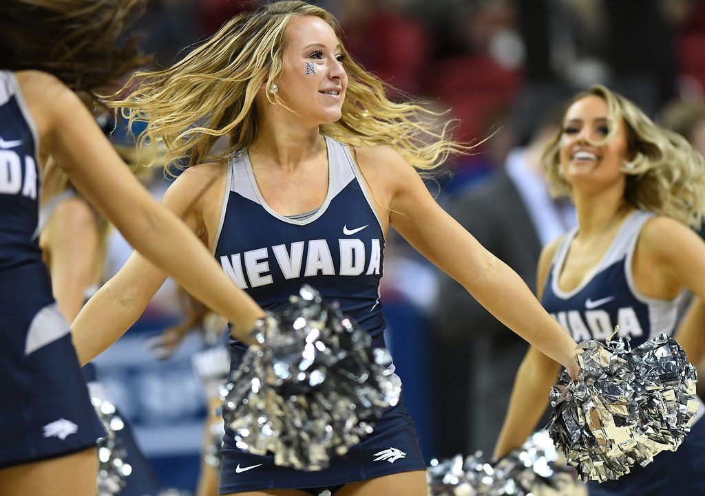 Mar 11, 2017; Las Vegas, NV, USA; Nevada Wolf Pack cheerleaders entertain the crowd during the Mountain West Conference Championship game between Nevada and the Colorado State Rams at Thomas and Mack Center. Mandatory Credit: Stephen R. Sylvanie-Imagn Images