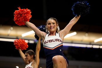 Mar 18, 2023; Birmingham, AL, USA; A cheerleader for the Auburn Tigers during the first half against the Houston Cougars at Legacy Arena. Mandatory Credit: Vasha Hunt-Imagn Images