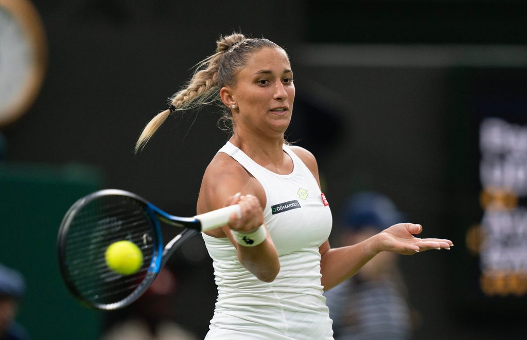 Jul 4, 2023; London, United Kingdom; Panna Udvardy (HUN) returns a shot during her match against Aryna Sabalenka on day two at the All England Lawn Tennis and Croquet Club. Mandatory Credit: Susan Mullane-Imagn Images