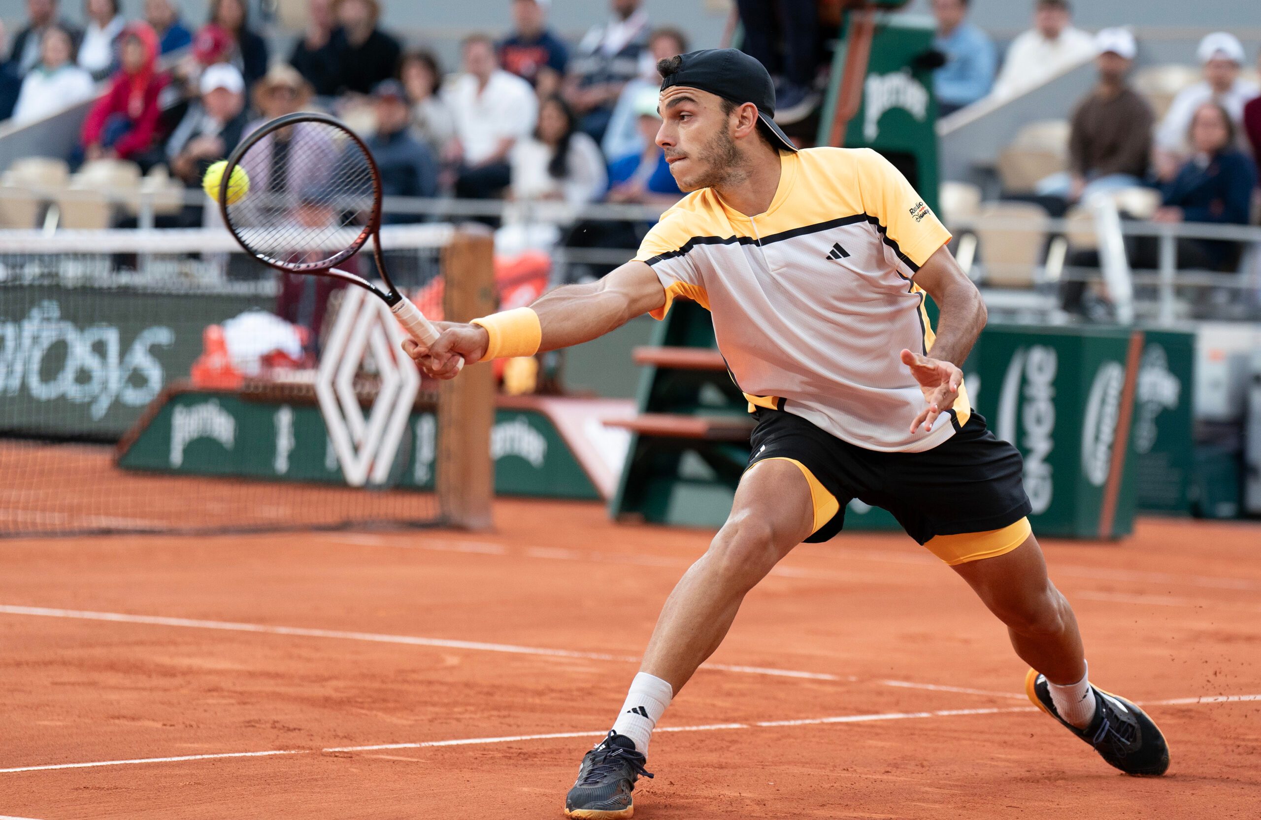Jun 3, 2024; Paris, France; Francisco Cerundolo of Argentina returns a shot during his match against Novak Djokovic of Serbia on day nine of Roland Garros at Stade Roland Garros. Mandatory Credit: Susan Mullane-Imagn Images