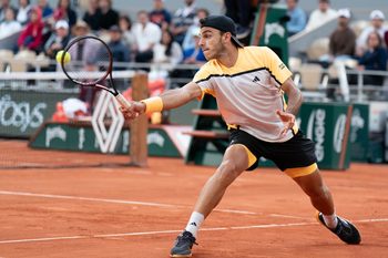 Jun 3, 2024; Paris, France; Francisco Cerundolo of Argentina returns a shot during his match against Novak Djokovic of Serbia on day nine of Roland Garros at Stade Roland Garros. Mandatory Credit: Susan Mullane-Imagn Images