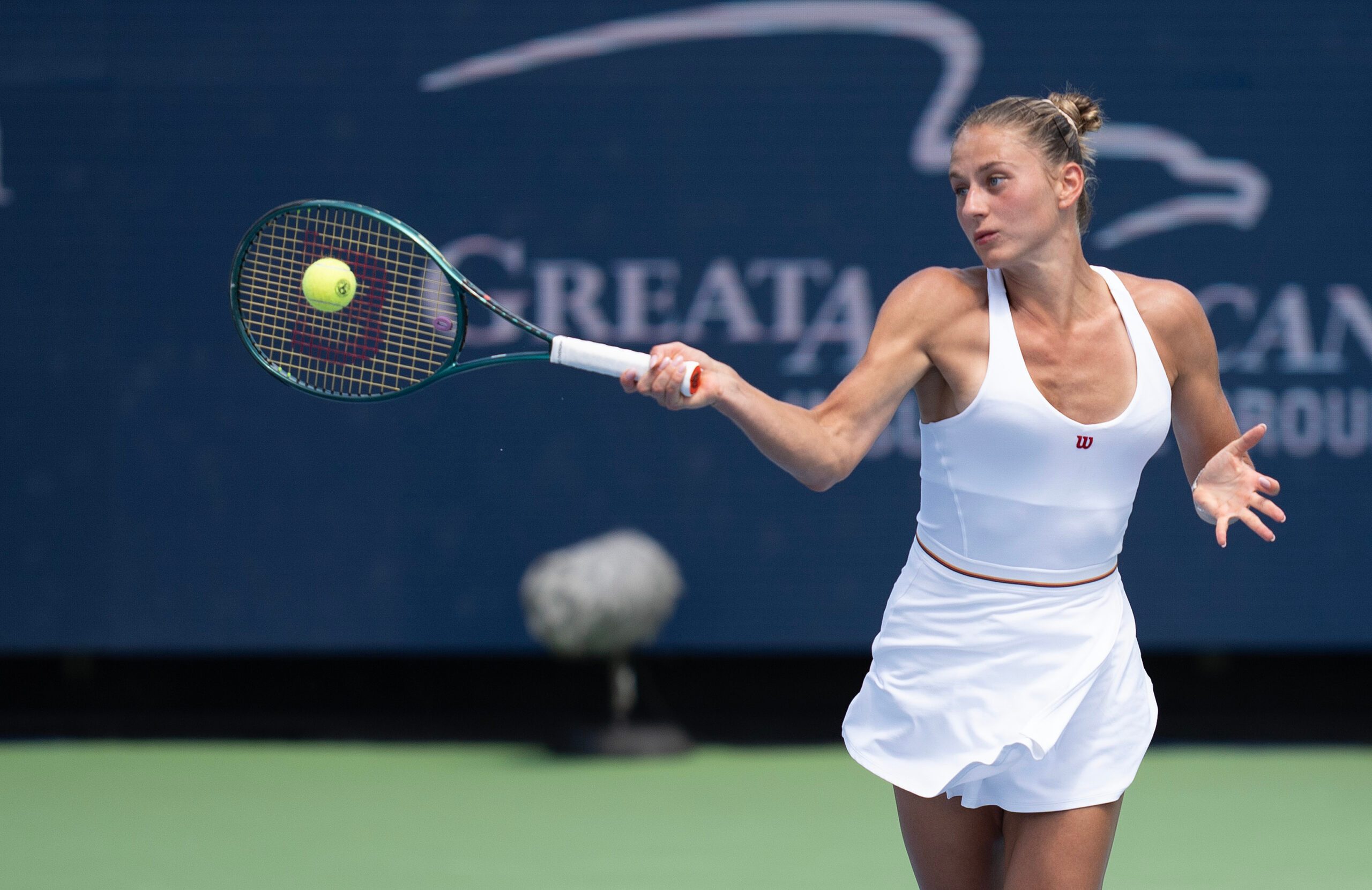 Aug 16, 2024; Cincinnati, OH, USA;  Marta Kostyuk of Ukraine returns a shot during her match against Iga Swiatek of Poland on day five of the Cincinnati Open. Mandatory Credit: Susan Mullane-Imagn Images