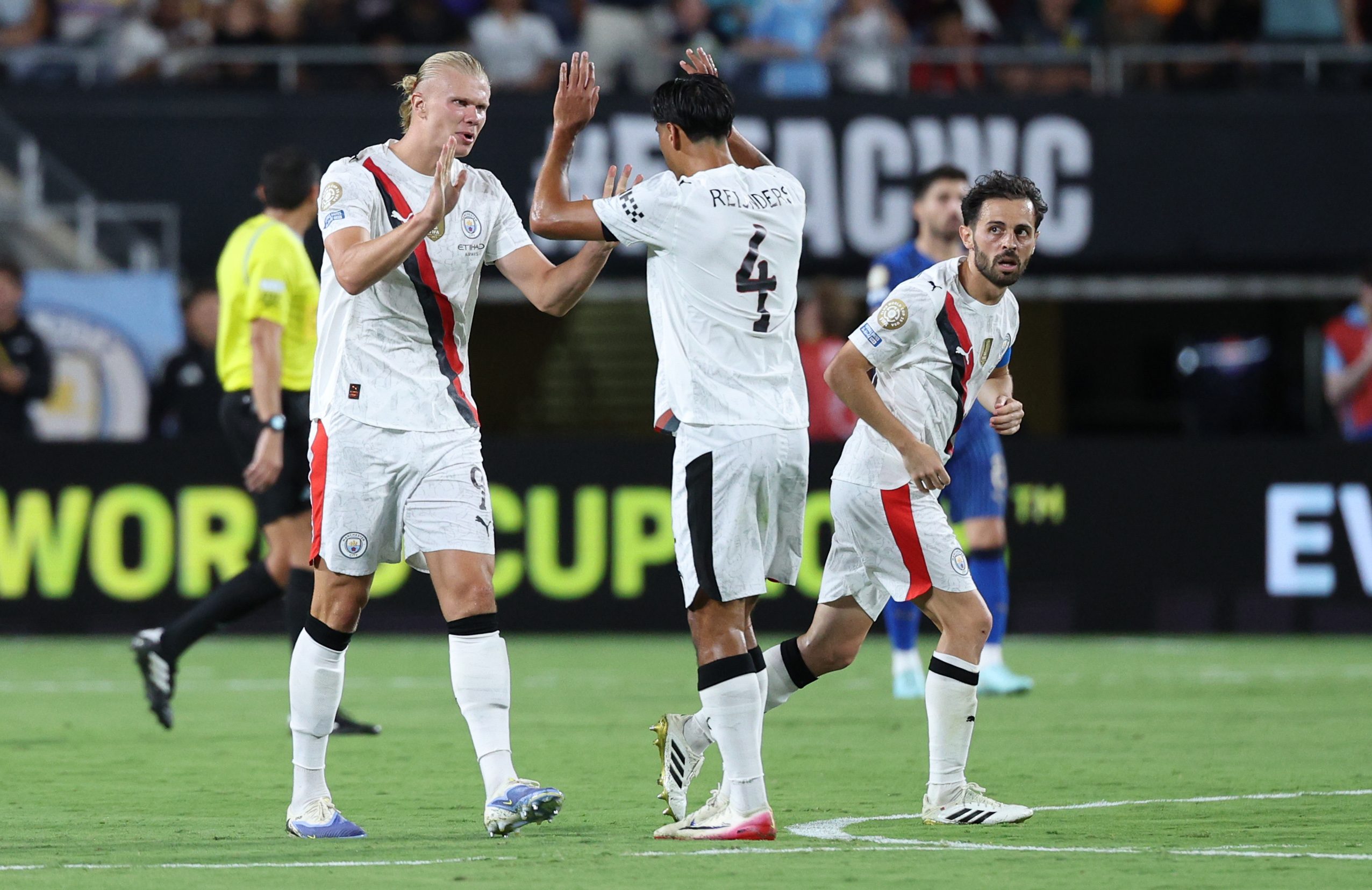 Jun 30, 2025; Orlando, Florida, USA; Manchester City forward Erling Haaland (9) celebrates with midfielder Tijjani Reijnders (4) after scoring in the second half during a round of 16 match of the 2025 FIFA Club World Cup at Camping World Stadium. Mandatory Credit: Nathan Ray Seebeck-Imagn Images
