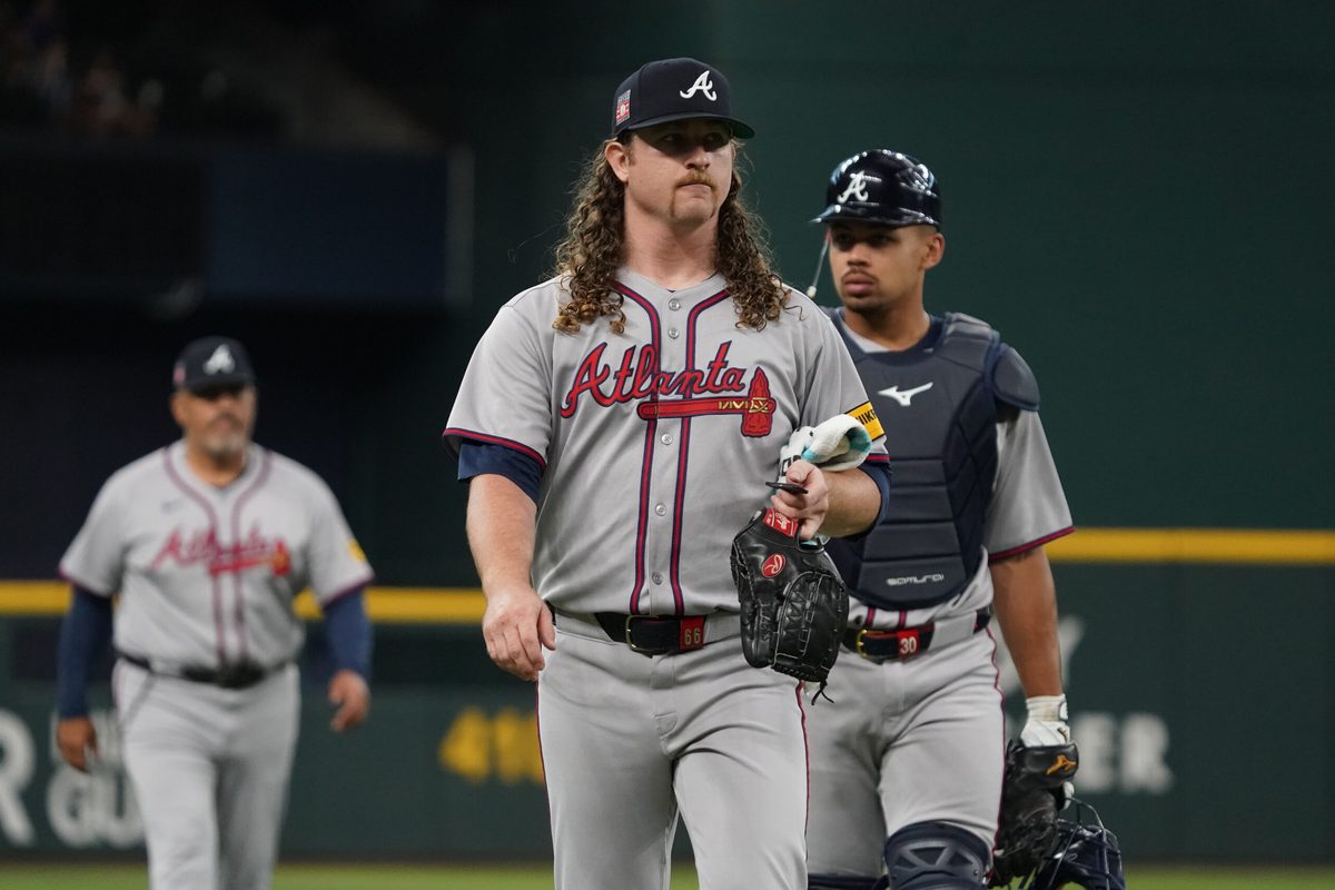 Jul 26, 2025; Arlington, Texas, USA; Atlanta Braves starting pitcher Grant Holmes (66) walks in from the bullpen prior to a game against the Texas Rangers at Globe Life Field. Mandatory Credit: Raymond Carlin III-Imagn Images