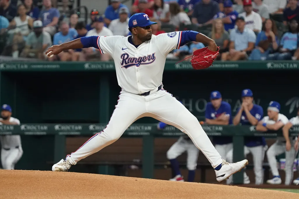 Jul 26, 2025; Arlington, Texas, USA; Texas Rangers starting pitcher Kumar Rocker (80) throws to the plate during the first inning against the Atlanta Braves at Globe Life Field. Mandatory Credit: Raymond Carlin III-Imagn Images