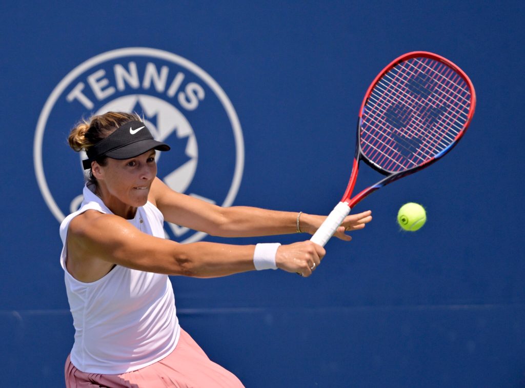 Jul 28, 2025; Montreal, QC, Canada; Tatjana Maria (GER) reacts returns the ball against Laura Siegemund (GER) in first round play at IGA Stadium. Mandatory Credit: Eric Bolte-Imagn Images