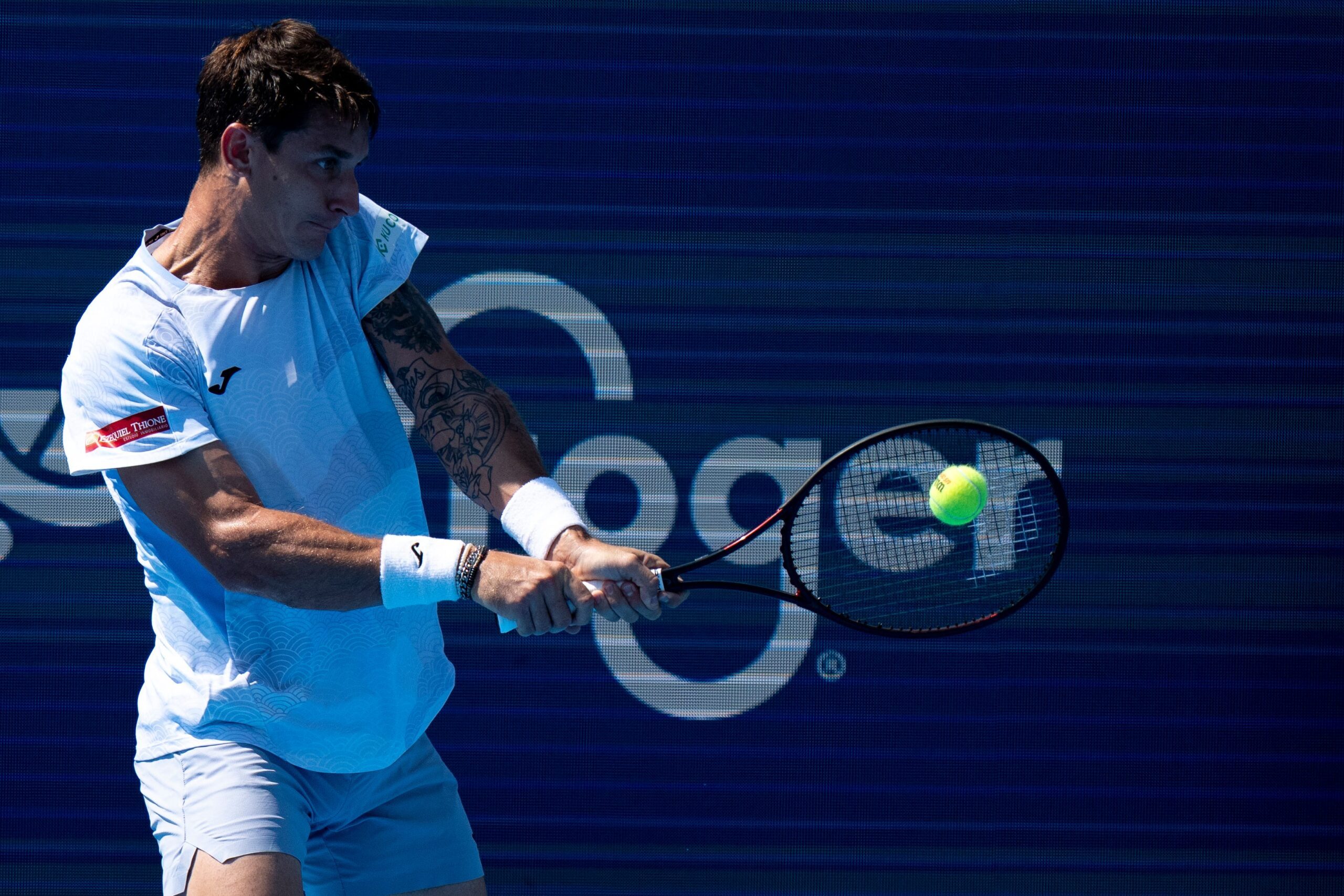 Camilo Ugo Carabelli, of Argentina, returns to Kei Nishikori, of the Japan, during the Cincinnati Open at the Lindner Family Tennis Center in Mason, Ohio, on Aug. 8, 2025.