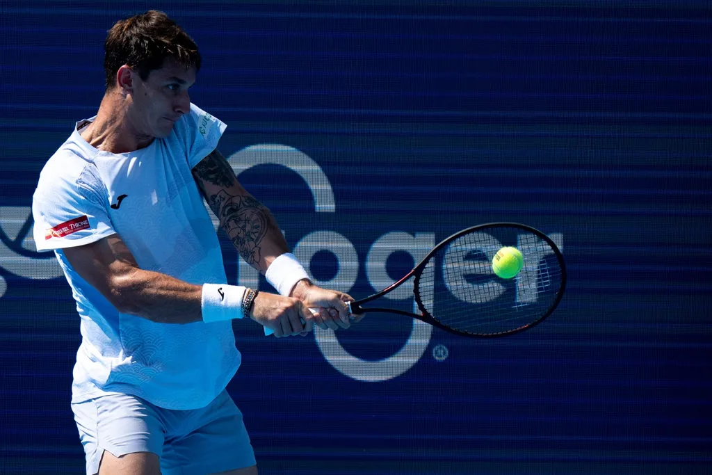 Camilo Ugo Carabelli, of Argentina, returns to Kei Nishikori, of the Japan, during the Cincinnati Open at the Lindner Family Tennis Center in Mason, Ohio, on Aug. 8, 2025.