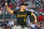 Sep 26, 2025; Cumberland, Georgia, USA; Pittsburgh Pirates pitcher Mitch Keller (23) pitches the ball against the Atlanta Braves during the first inning at Truist Park. Mandatory Credit: Jordan Godfree-Imagn Images
