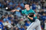 Oct 13, 2025; Toronto, Ontario, CAN; Seattle Mariners pitcher Emerson Hancock (26) delivers a pitch in the ninth inning against the Toronto Blue Jays during game two of the ALCS round for the 2025 MLB playoffs at Rogers Centre. Mandatory Credit: Nick Turchiaro-Imagn Images