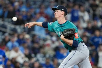 Oct 13, 2025; Toronto, Ontario, CAN; Seattle Mariners pitcher Emerson Hancock (26) delivers a pitch in the ninth inning against the Toronto Blue Jays during game two of the ALCS round for the 2025 MLB playoffs at Rogers Centre. Mandatory Credit: Nick Turchiaro-Imagn Images