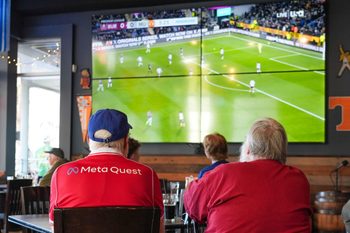 Mike Davis (left) and David Austin (right) watch a Manchester United FC game viewing at Fred's Around the Corner at 421 Union Ave in downtown Knoxville on Jan. 7, 2025.