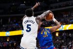 Mar 1, 2026; Denver, Colorado, USA; Minnesota Timberwolves guard Anthony Edwards (5) blocks the shot by Denver Nuggets guard Bruce Brown (11) in the second half at Ball Arena. Mandatory Credit: Ron Chenoy-Imagn Images
