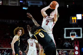 Oklahoma Sooners guard Dayton Forsythe (7) is fouled by Missouri Tigers guard Anthony Robinson II (0) as he shoots during an NCAA men's basketball game between the University of Oklahoma Sooners (OU) and the Missouri Tigers at Lloyd Noble Center in Norman, Okla., Tuesday, March 3, 2026. Oklahoma won 80-64.