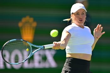 Mar 4, 2026; Indian Wells, CA, USA; Yulia Putintseva (KAZ) hits a shot against Paula Badosa (ESP) in her first round match during the BNP Paribas Open at the Indian Wells Tennis Garden. Mandatory Credit: Jayne Kamin-Oncea-Imagn Images