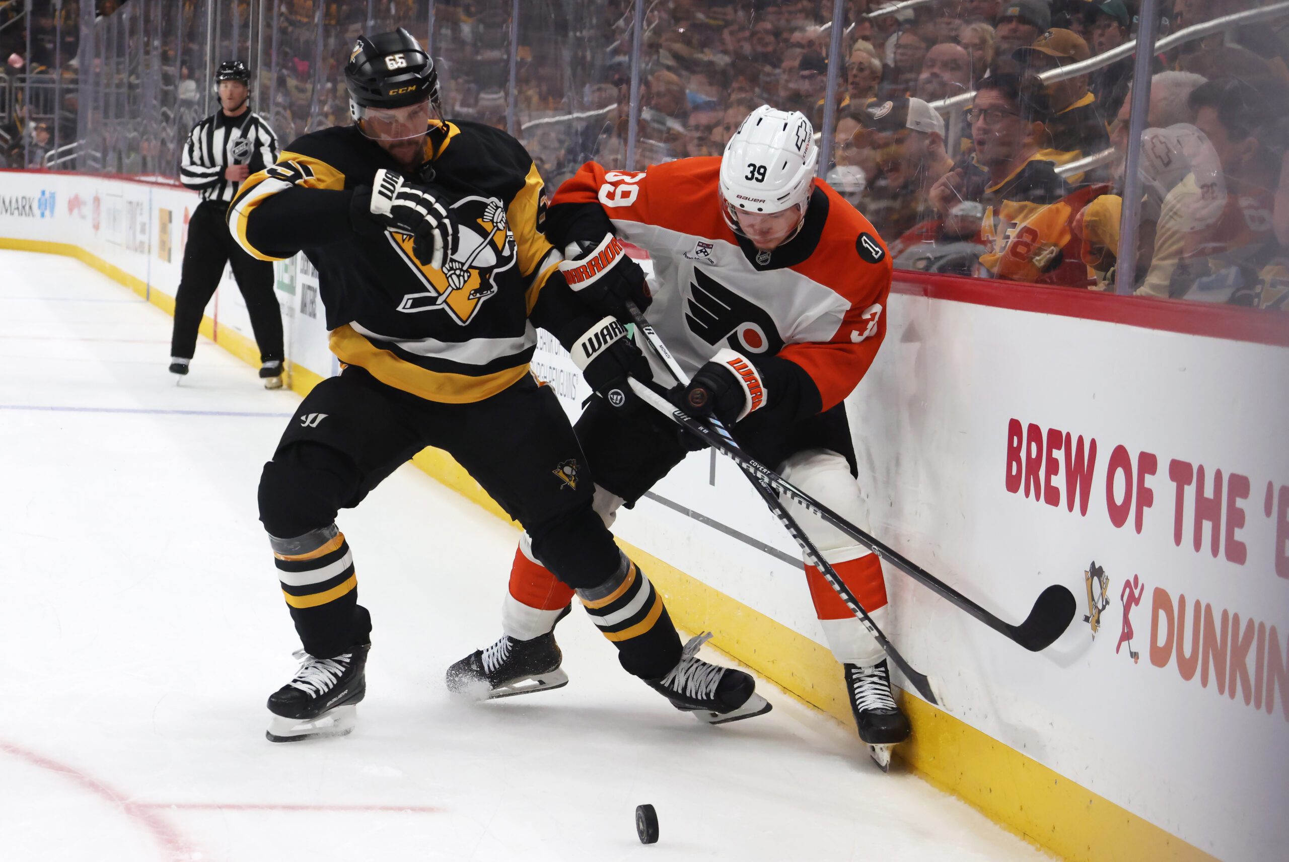 Mar 7, 2026; Pittsburgh, Pennsylvania, USA;  Pittsburgh Penguins defenseman Erik Karlsson (65) and Philadelphia Flyers right wing Matvei Michkov (39) battle for the puck during the third period at PPG Paints Arena. Mandatory Credit: Charles LeClaire-Imagn Images