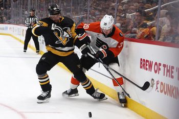 Mar 7, 2026; Pittsburgh, Pennsylvania, USA;  Pittsburgh Penguins defenseman Erik Karlsson (65) and Philadelphia Flyers right wing Matvei Michkov (39) battle for the puck during the third period at PPG Paints Arena. Mandatory Credit: Charles LeClaire-Imagn Images