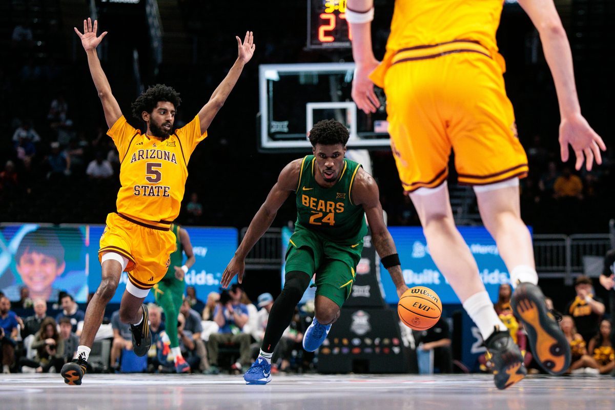 Mar 10, 2026; Kansas City, MO, USA; Baylor Bears guard Tounde Yessoufou (24) dribbles against Arizona State Sun Devils guard Maurice Odum (5) during the second half at T-Mobile Center. Mandatory Credit: William Purnell-Imagn Images
