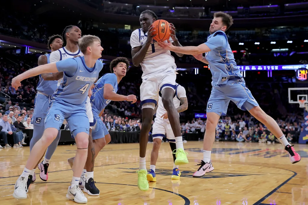 Mar 12, 2026; New York, NY, USA; Seton Hall Pirates guard Jacob Dar (1) grabs a rebound against Creighton Bluejays guard Josh Dix (4) and forward Jasen Green (0) and guard Fedor Zugic (7) during the second half at Madison Square Garden. Mandatory Credit: Brad Penner-Imagn Images