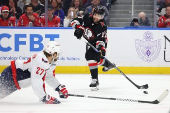 Mar 12, 2026; Buffalo, New York, USA;  Washington Capitals defenseman Timothy Liljegren (27) tries to block a shot by Buffalo Sabres left wing Jason Zucker (17) during the second period at KeyBank Center. Mandatory Credit: Timothy T. Ludwig-Imagn Images