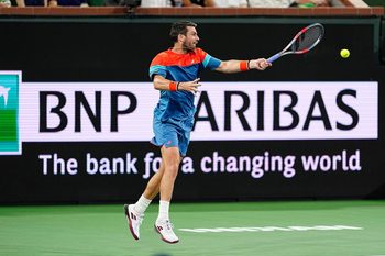 Cameron Norrie returns to Carlos Alcaraz during their BNP Paribas Open quarterfinal match on Stadium 1 at the Indian Wells Tennis Garden in Indian Wells, Calif., on Thursday, March 12, 2026.