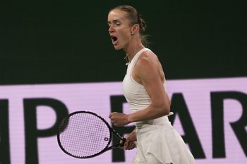 Elina Svitolina reacts to winning a point to extend her match against Elena Rybakina in the women’s semifinal at the BNP Paribas Open at the Indian Wells Tennis Garden in Indian Wells, Calif., March 13, 2026.