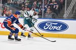 Mar 17, 2026; Edmonton, Alberta, CAN; Edmonton Oilers defenseman Connor Murphy (5) chases the puck with San Jose Sharks defenseman Nick Leddy (4) during the second period at Rogers Place. Mandatory Credit: Walter Tychnowicz-Imagn Images