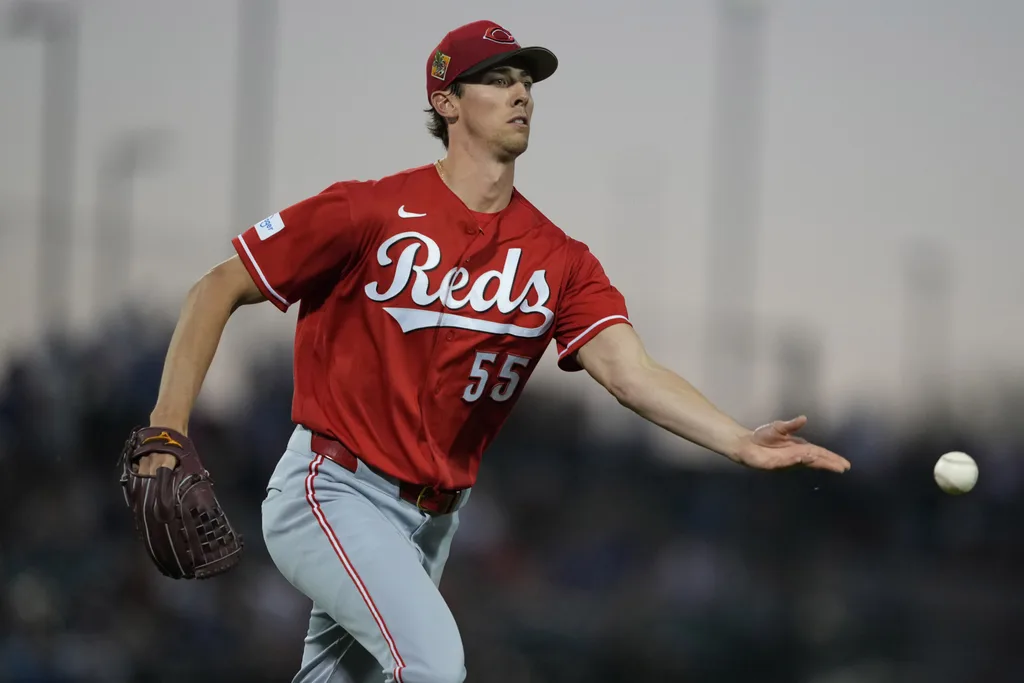 Mar 20, 2026; Mesa, Arizona, USA; Cincinnati Reds pitcher Brandon Williamson (55) flips the ball for an out against the Chicago Cubs in the third inning at Sloan Park. Mandatory Credit: Rick Scuteri-Imagn Images