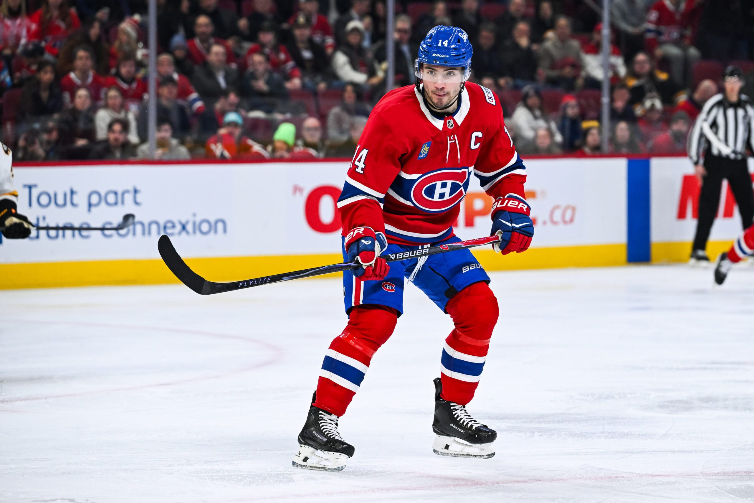 Mar 17, 2026; Montreal, Quebec, CAN; Montreal Canadiens center Nick Suzuki (14) skates against the Boston Bruins during the second period at Bell Centre. Mandatory Credit: David Kirouac-Imagn Images