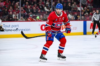 Mar 17, 2026; Montreal, Quebec, CAN; Montreal Canadiens center Nick Suzuki (14) skates against the Boston Bruins during the second period at Bell Centre. Mandatory Credit: David Kirouac-Imagn Images