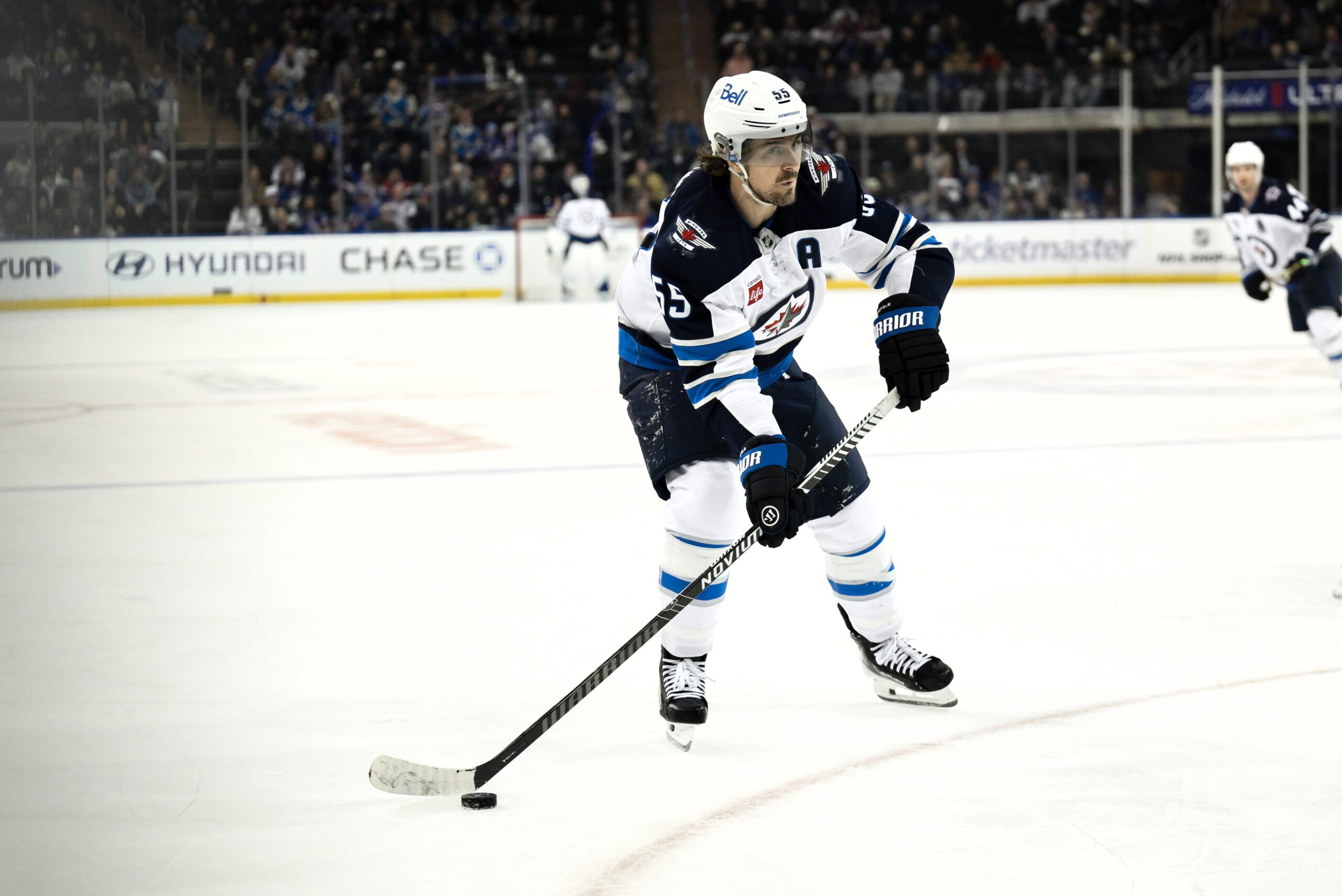 Mar 22, 2026; New York, New York, USA; Winnipeg Jets center Mark Scheifele (55) skates with the puck against the New York Rangers during the third period at Madison Square Garden. Mandatory Credit: John Jones-Imagn Images