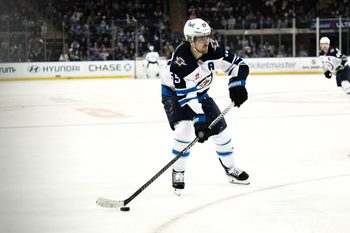 Mar 22, 2026; New York, New York, USA; Winnipeg Jets center Mark Scheifele (55) skates with the puck against the New York Rangers during the third period at Madison Square Garden. Mandatory Credit: John Jones-Imagn Images