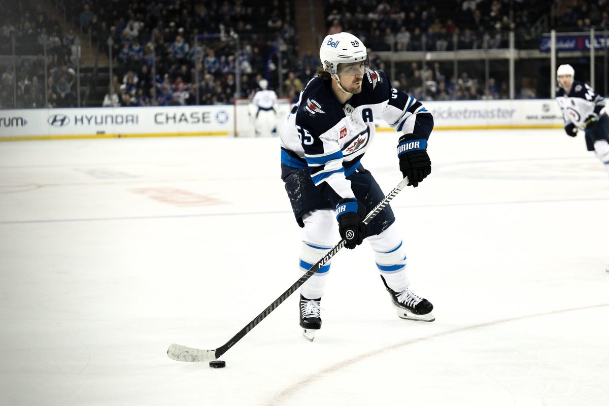 Mar 22, 2026; New York, New York, USA; Winnipeg Jets center Mark Scheifele (55) skates with the puck against the New York Rangers during the third period at Madison Square Garden. Mandatory Credit: John Jones-Imagn Images