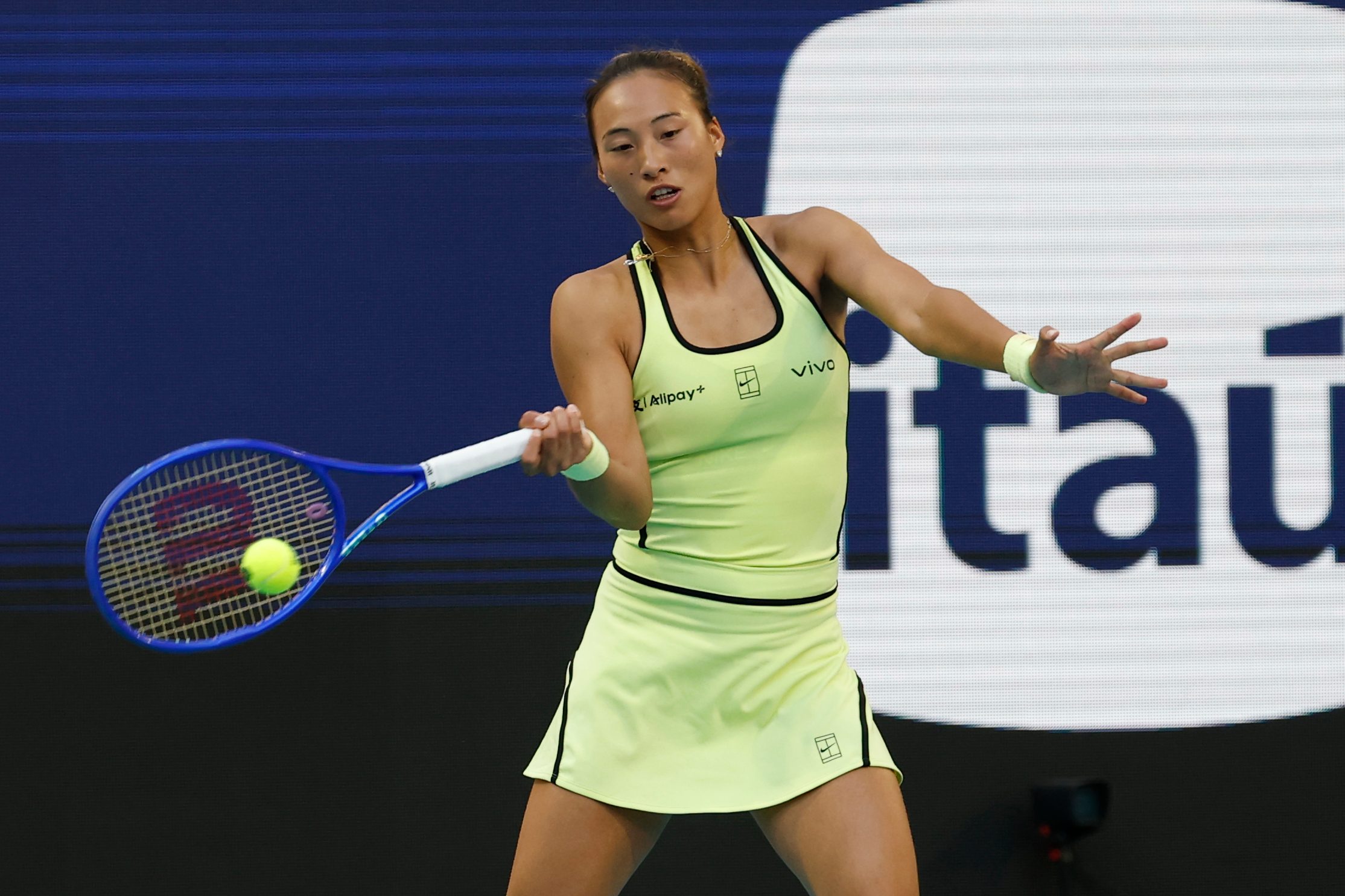 Mar 23, 2026; Miami Gardens, FL, USA; Qinwen Zheng (CHN) hits a forehand against Aryna Sabalenka (not pictured) on day 7 of the 2026 Miami Open at Hard Rock Stadium. Mandatory Credit: Geoff Burke-Imagn Images