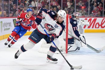 Mar 26, 2026; Montreal, Quebec, CAN; Columbus Blue Jackets defenseman Ivan Provorov (9) plays the puck and Montreal Canadiens forward Ivan Demidov (93) forechecks during the second period at the Bell Centre. Mandatory Credit: Eric Bolte-Imagn Images