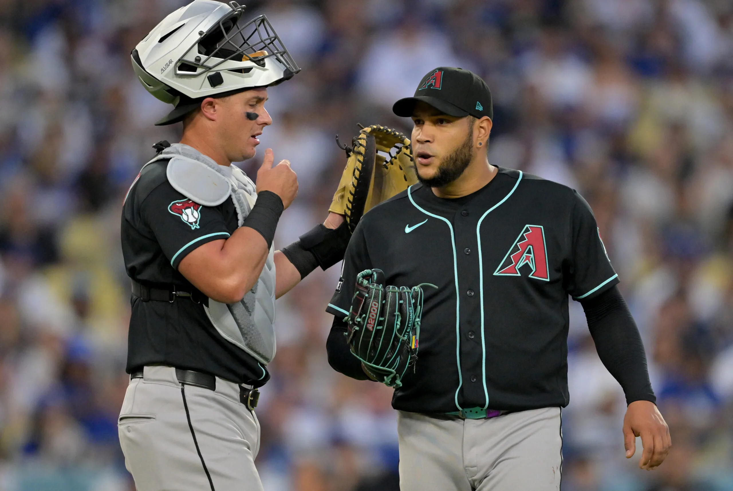 Mar 28, 2026; Los Angeles, California, USA; Arizona Diamondbacks catcher James McCann (8) talks to pitcher Eduardo Rodriguez (57) during the third inning against the Los Angeles Dodgers at Dodger Stadium. Mandatory Credit: Jayne Kamin-Oncea-Imagn Images