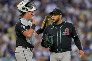Mar 28, 2026; Los Angeles, California, USA; Arizona Diamondbacks catcher James McCann (8) talks to pitcher Eduardo Rodriguez (57) during the third inning against the Los Angeles Dodgers at Dodger Stadium. Mandatory Credit: Jayne Kamin-Oncea-Imagn Images