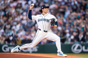 Mar 28, 2026; Seattle, Washington, USA; Seattle Mariners starter Bryan Woo (22) delivers a pitch during the first inning against the Cleveland Guardians at T-Mobile Park. Mandatory Credit: Stephen Brashear-Imagn Images