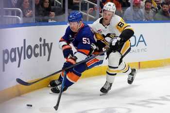 Mar 30, 2026; Elmont, New York, USA; New York Islanders center Casey Cizikas (53) fights for the puck against Pittsburgh Penguins center Ben Kindel (81) during the first period at UBS Arena. Mandatory Credit: Brad Penner-Imagn Images