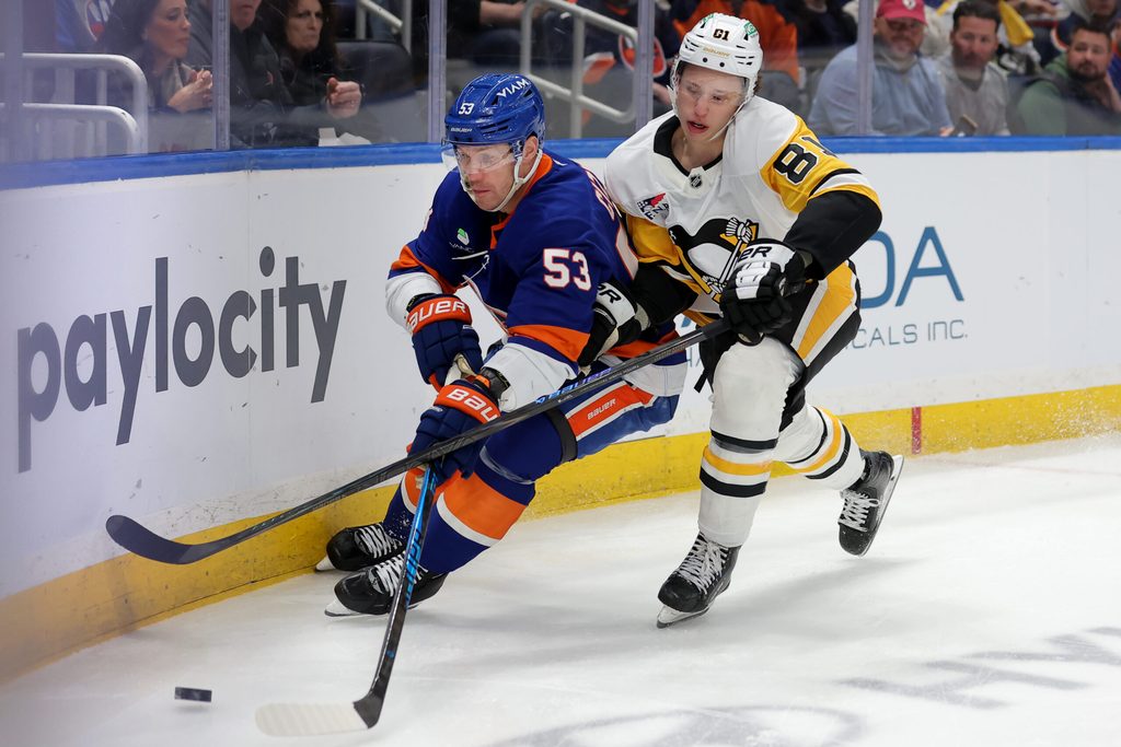 Mar 30, 2026; Elmont, New York, USA; New York Islanders center Casey Cizikas (53) fights for the puck against Pittsburgh Penguins center Ben Kindel (81) during the first period at UBS Arena. Mandatory Credit: Brad Penner-Imagn Images